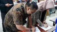 Penandatangan MoU antara Universitas Bina Darma Palembang dengan PT Rifan Financindo Berjangka Palembang